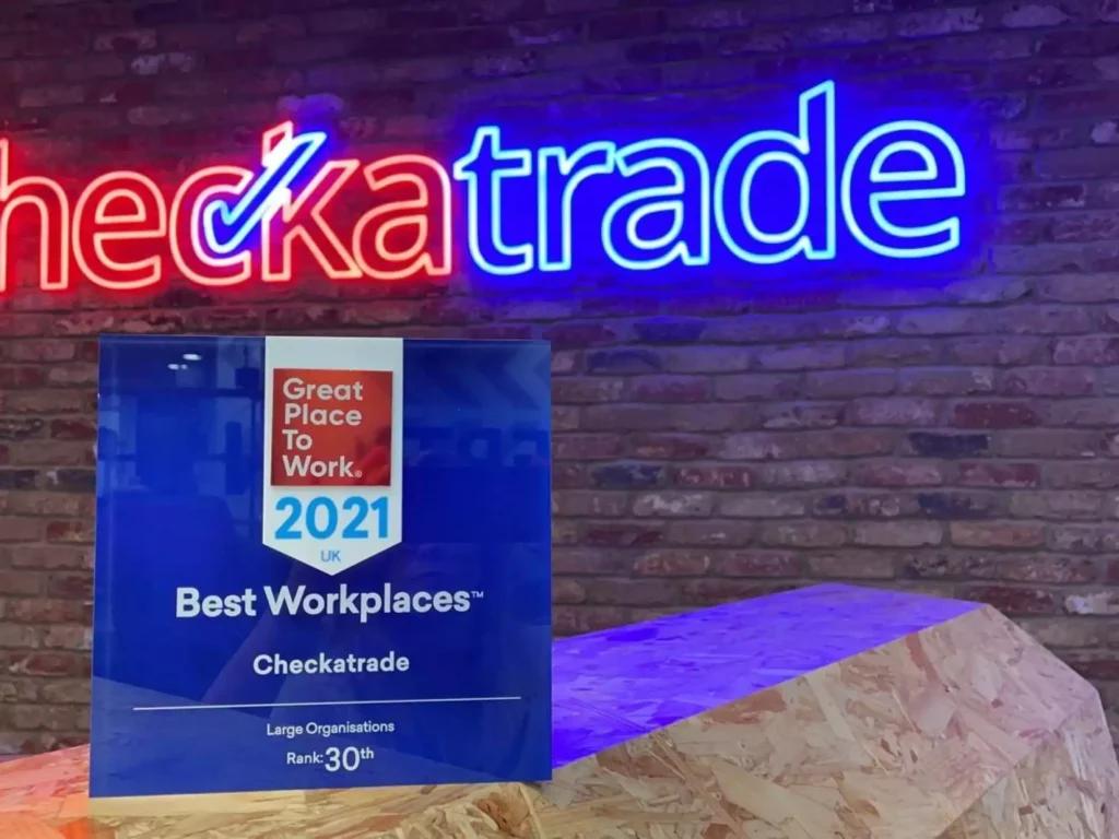 checkatrade logo on wall and great place to work icon