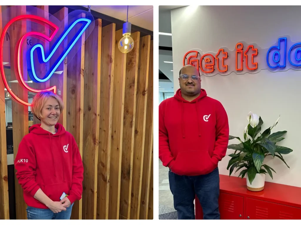 woman and man in red branded hoodies in office