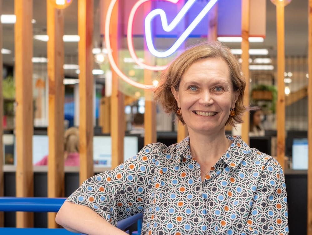 lady in colourful shirt with and on hip